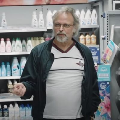 Clark Olofsson is doing his shopping while also talking to the camera who is recording him for the documentary.